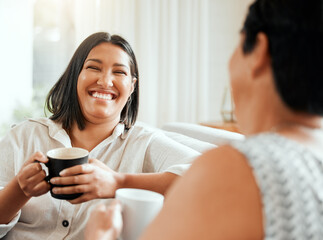 Woman, happy and coffee on sofa with mother, bonding and laugh at funny story at home. Mom, daughter or smile in living room for tea time, reunion or relationship development by sharing good memories