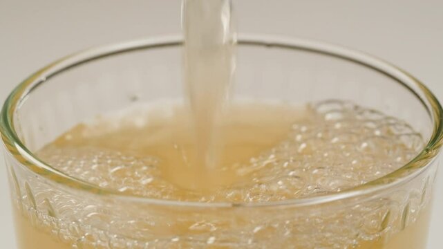 Apple cider, Orange or white wine bottle and glass, spanish french apple cider pouring, pouring of ecological natural wine. 
