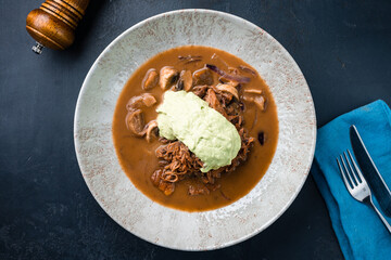Meat soup with beef, champignon, onion and sauce.