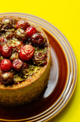 A small cake with berries on top of it