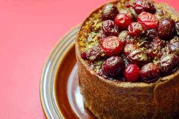A small cake with berries on top of it
