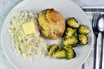 boneless pork chop  on rice with  roasted brussel sprouts