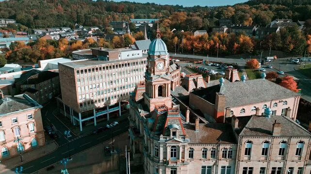 Aerial drone footage of the English market town centre of Dewsbury in West Yorkshire in the UK showing the historical town centre and the Dewsbury townhall.