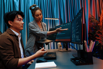 Serious of IT developers discussing intelligent website development coder system running data...