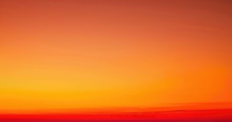 Naklejka premium A serene sunset blending warm hues of orange and yellow, creating a calming atmosphere.