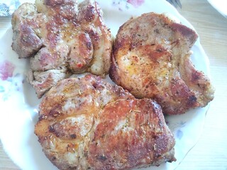 grilled pork chops on the plate 