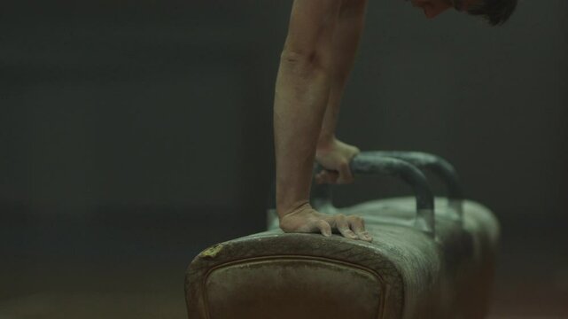 A male gymnast doing headstand
