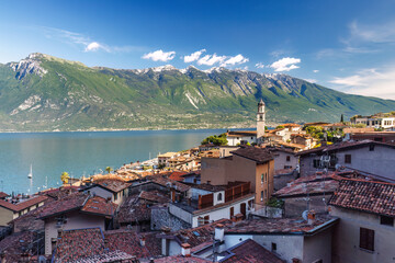Limone Sul Garda town on shore of Lake Garda with mountains in background, Italy, Europe.