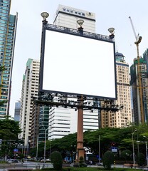 Obraz premium Blank Billboard on City Street with Buildings