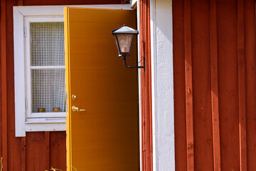 Open door at old red house