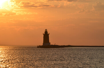 Delaware Breakwater Lighthouse at Cape Henlopen State Park at sunset