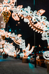 Vertical pic of defocused blurred night city lights bokeh in winter city