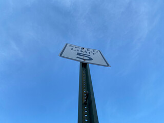Looking up at a posted sign