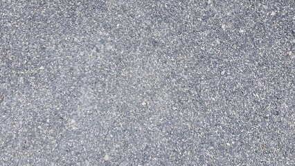 Texture image of small gray and white pebble stone floor. Gray small rocks ground texture. black small road stone background.