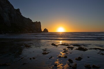 The sun sets over the Pacific in Morro Bay, California