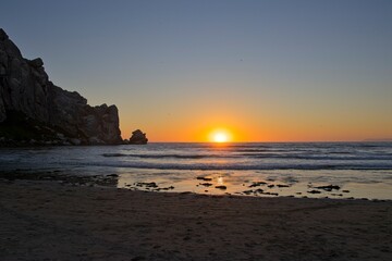 The sun sets over the Pacific in Morro Bay, California