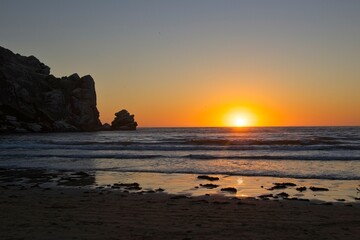The sun sets over the Pacific in Morro Bay, California