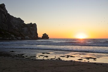 The sun sets over the Pacific in Morro Bay, California