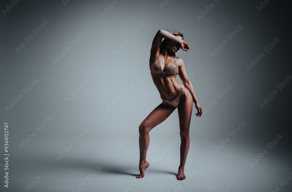 Sticker Young slim fitness woman in lingerie studio posing