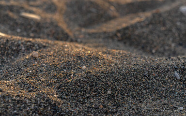 Abstract background of beach sand lit by the sun