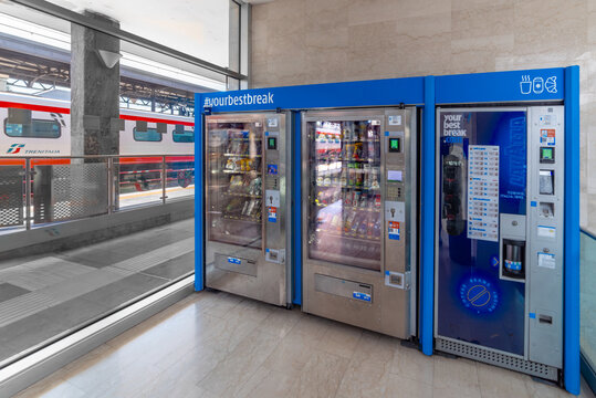 Italy - August 20, 2024: Automatic dispensers for soft drinks, water, snacks and coffee in the break coffee area overlooking on Trenitalia frecciargento train in Asti railway station
