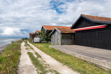 Travelling in France, old wooden huts and oysters farms in Gujan-Mestras village, cultivation and sale of fresh oysters seashells, Arcachon bay, Atlantic ocean, France, tourists destination