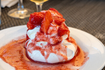 Sweet french dessert, Red strawberry fruit pavlova served in restaurant in Saint-Tropez, France
