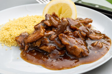 Meat dish Caramel pork served with couscous