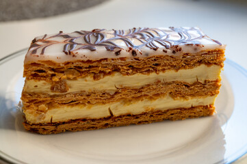 Portion of french mille-feuille cake, vanilla or custard slice, Napoleon puff pastry layered with...