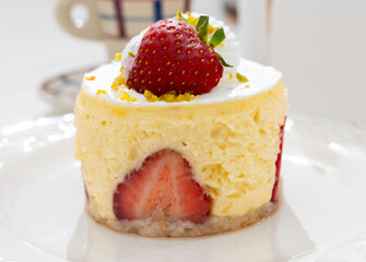 Red fruit sweet dessert cheesecake tart with fresh strawberries in bakery