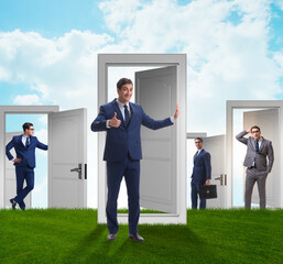 Businessman in uncertainty concept with many doors