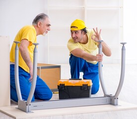 Two contractors carpenters working indoors