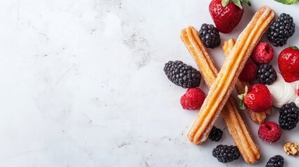 A close-up shot of churros, fresh berries, and whipped cream on a light grey background.