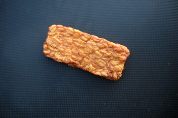 Traditional indonesian culinary food. Tempe Goreng Indonesia Food that is simple and often made at home. Indonesian Street Food. Tempe goreng or fried tempe.