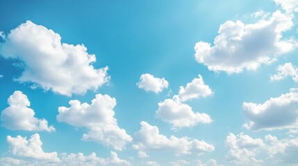 Fototapeta premium Radiant and serene sky with puffy white clouds and a clear horizon, ideal for showcasing the tranquility of a summer day