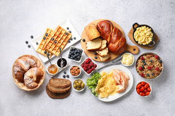 Tasty breakfast. Flat lay composition with many different food on grey textured table