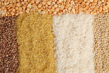 Different types of cereals and peas as background, top view