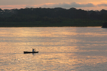 Canoe on Amazon River at Sunset