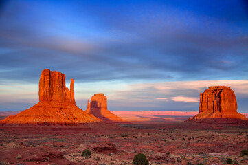 Monument valley west mitten casts shadow on east mitten sunset sunrise