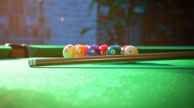 A sleek billiard stick resting on the surface of a pool table, with the green felt providing a vibrant contrast. The cue stick has a smooth finish and sits beside a neatly arranged triangle of billiar