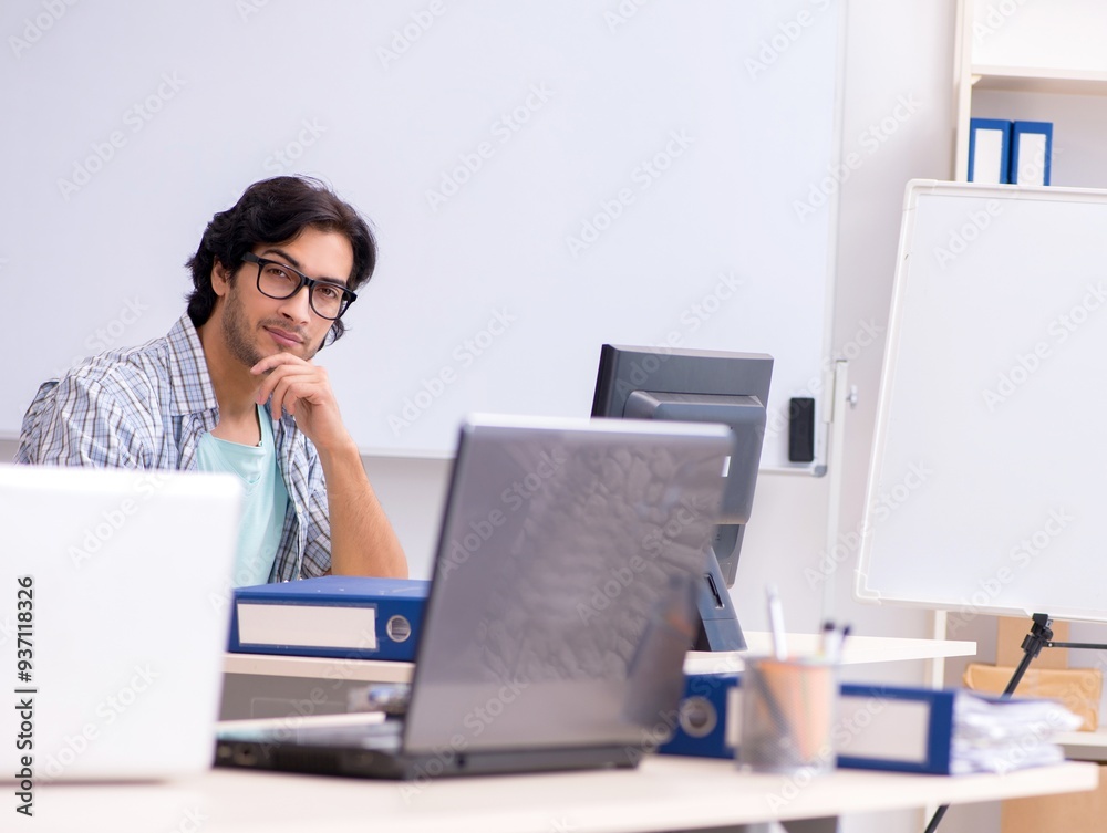 Wall mural it specialist working in the office