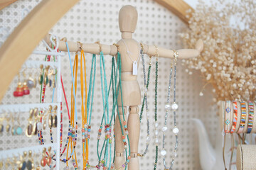 An Exquisite Handcrafted Jewelry Display Featuring Colorful Necklaces and Elegant Earrings