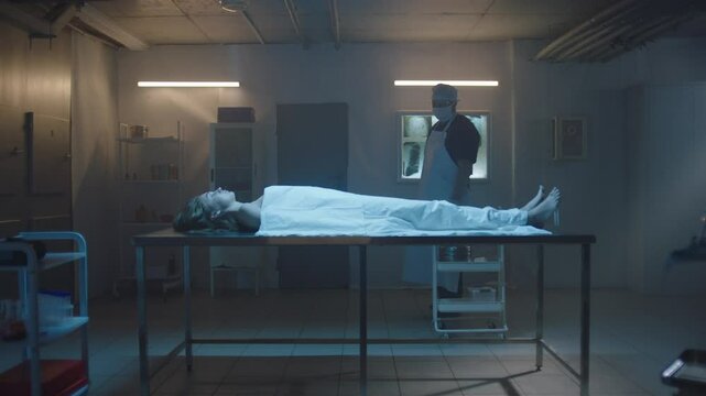 Pathologist and woman's cadaver on the table