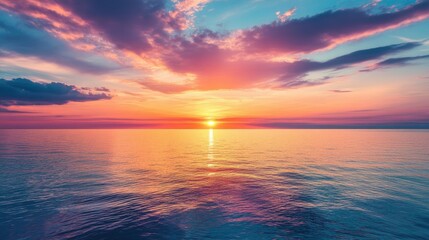 Beautiful sunset with vibrant colors over a calm sea, with space for text.