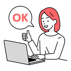 OKサインをするノートパソコンで仕事をしているカジュアルな女性