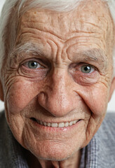 happy face of smiling elderly man with grey hair and deep wrinkles, portrait close-up, good mood and relaxed facial expression, eye-contact direct, caucasian ,age 70-100