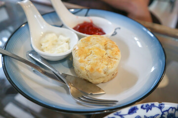 scone or scone with whipped cream and strawberry jam