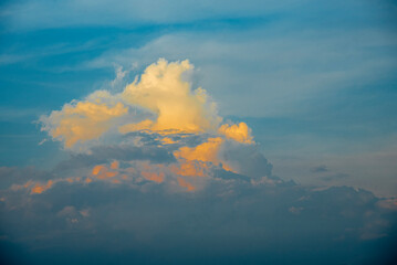 Golden and black clouds in the sky before the sun sets. n, beautiful colorful clouds