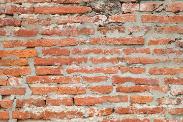 The old brick block wall outdoor with stain and crack for vintage surface texture vintage background.