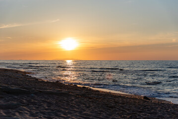 Obraz premium Beautiful scenic sunset over mediterranean sea, seen from the Valledoria beach, Sardinia, Italy. 
